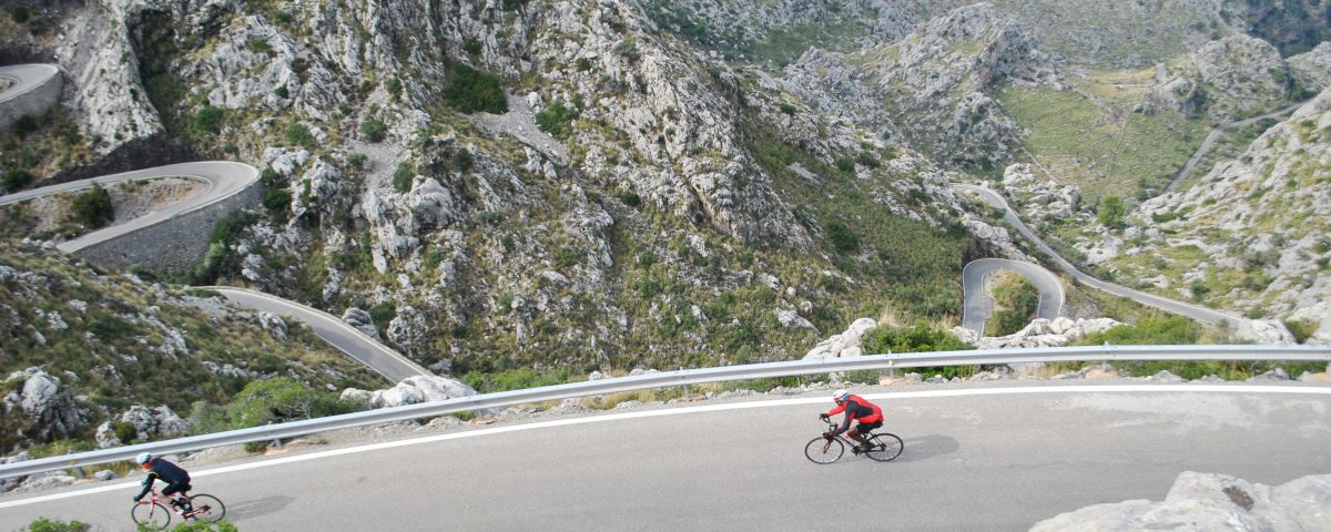 Cyclist riding the snake road sa calobra in majorca on an organised cycling holiday with cycle tour operator european cycling tours