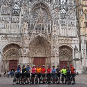 cyclists standing outside Rouen cathedral in Normandy while on a organised cycling holiday in Normandy with cycle tour operator, European Cycling Tours