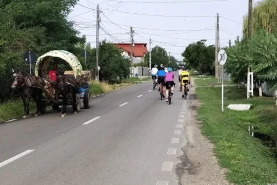 Cyclists riding bikes through the peaceful unspoilt country of Romania while cycling to the Transfagarasan on the organised cycling holiday by European Cycling Tours