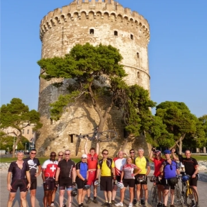 Cyclists in the historic city of Thessaloniki, Greece celebrating after riding their bikes from Dubrovnik through Croatia, Albania and Montenegro on an organised cycling adventure by cycling tour operator, "European Cycling Tours"
