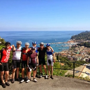 Group of friends looking down on Portofino while on an organised cycling holiday through Italy with UK cycle tour company, European Cycling Tours