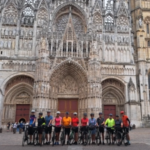 cyclists standing outside Rouen cathedral in Normandy while on a organised cycling holiday in Normandy with cycle tour operator, European Cycling Tours