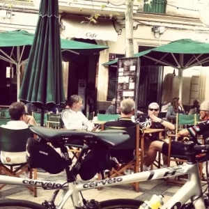 Cyclists taking a break at a cafe while on a guided cycling holiday in Europe organised by cycle tour company, European Cycling Tours