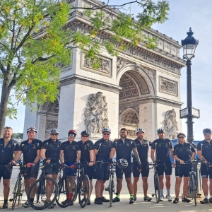 Cyclists at Arc de Triomphe after cycling London to Paris in 3 days with European cycling tours fully supported and guided London to Paris bike ride