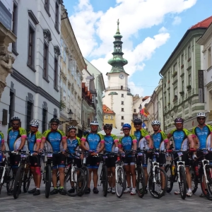 Group of cyclists standing in one of Bratislava's historic streets while cycling the Danube on organised cycling holiday with European Cycling Tours