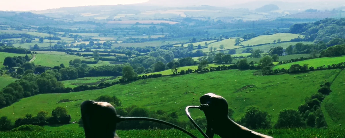 Panoramic view of cyclists riding through the english countryside on a guided coast to coast bike ride