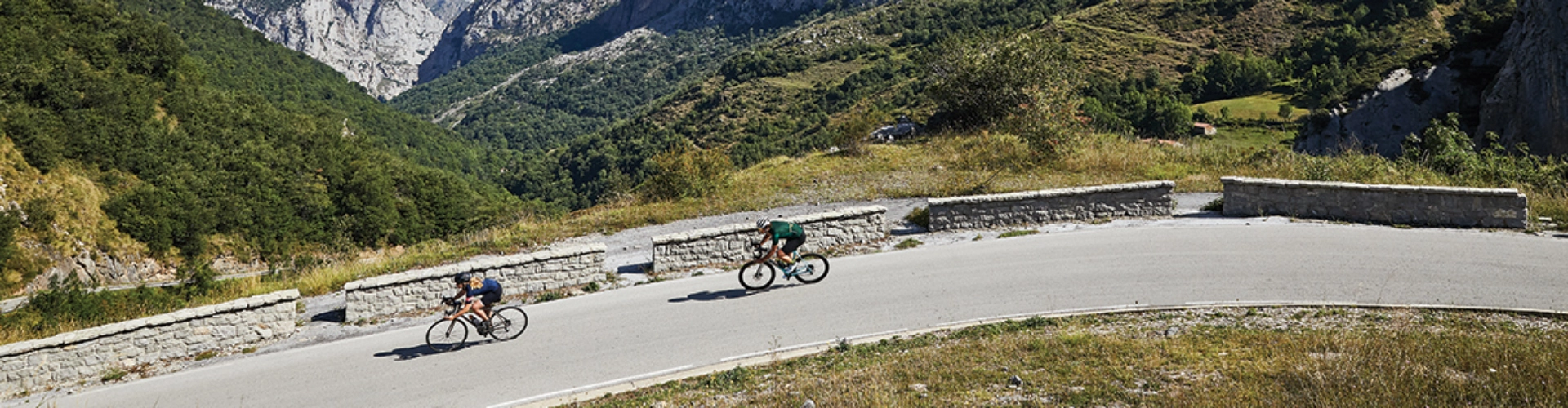 A view cyclists riding through the beautiful countryside of the Picos de Europa on a supported cycling holiday during the solar eclipse 2026 - now booking for the 2026 season