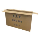 A reinforced cardboard bike box prepared for international travel to a cycling holiday in europe read our expert guide on flying with your road bike