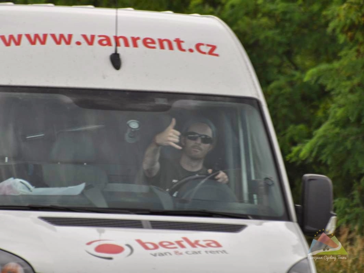 European Cycling Tours support driver giving a thumbs up from the van during a guided holiday; learn how our team supports your ride.
