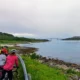 A group of cyclists admiring the panoramic coastal view and the sommarøy bridge during a guided arctic cycling tour in norway view our full atlantic coast itinerary for more details