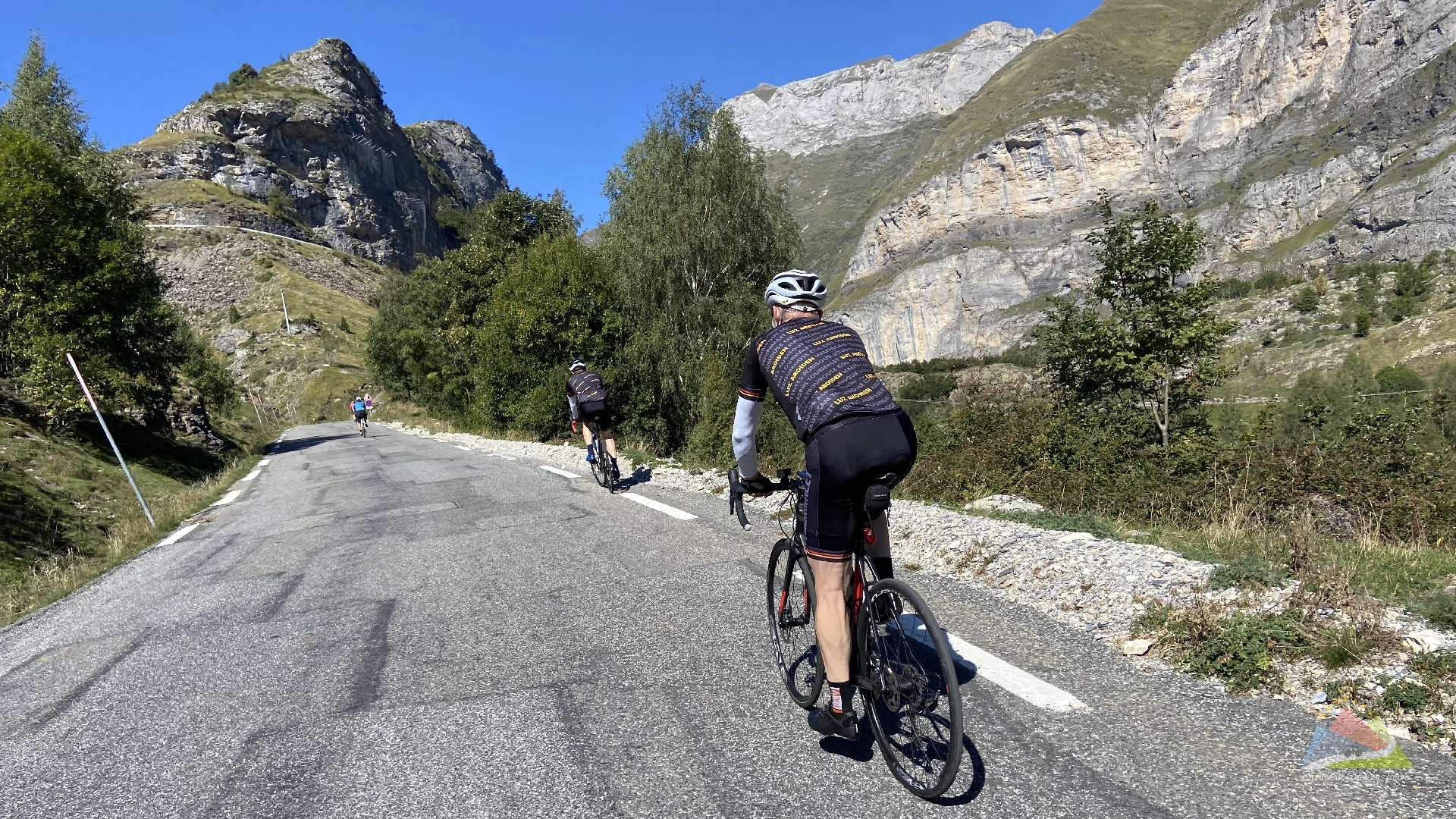 A group of cyclists enjoying the challenging ascent of the alto de langliru climb in asturias browse our portfolio of professionally guided cycling holidays across europe