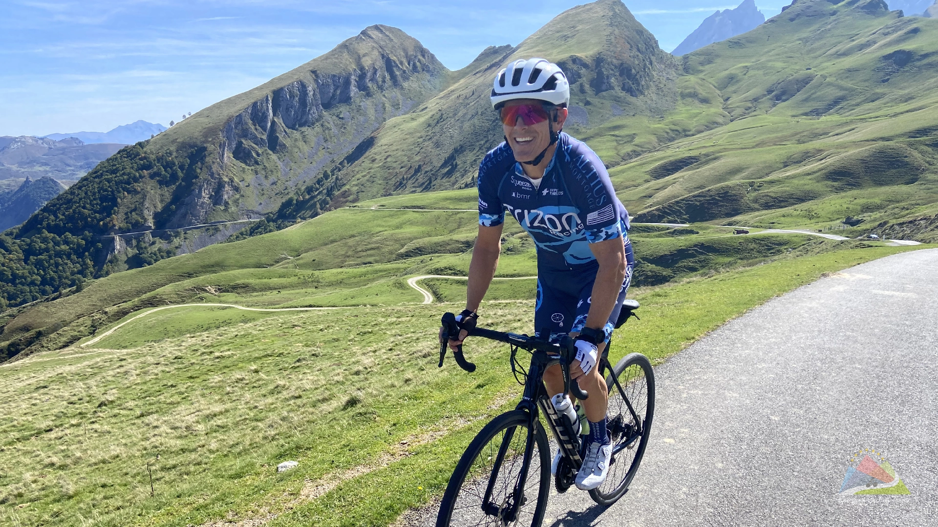 A cyclist enjoying a scenic ascent on the col daubisque climb in the french pyrenees explore our comprehensive collection of guided cycling holidays across europe