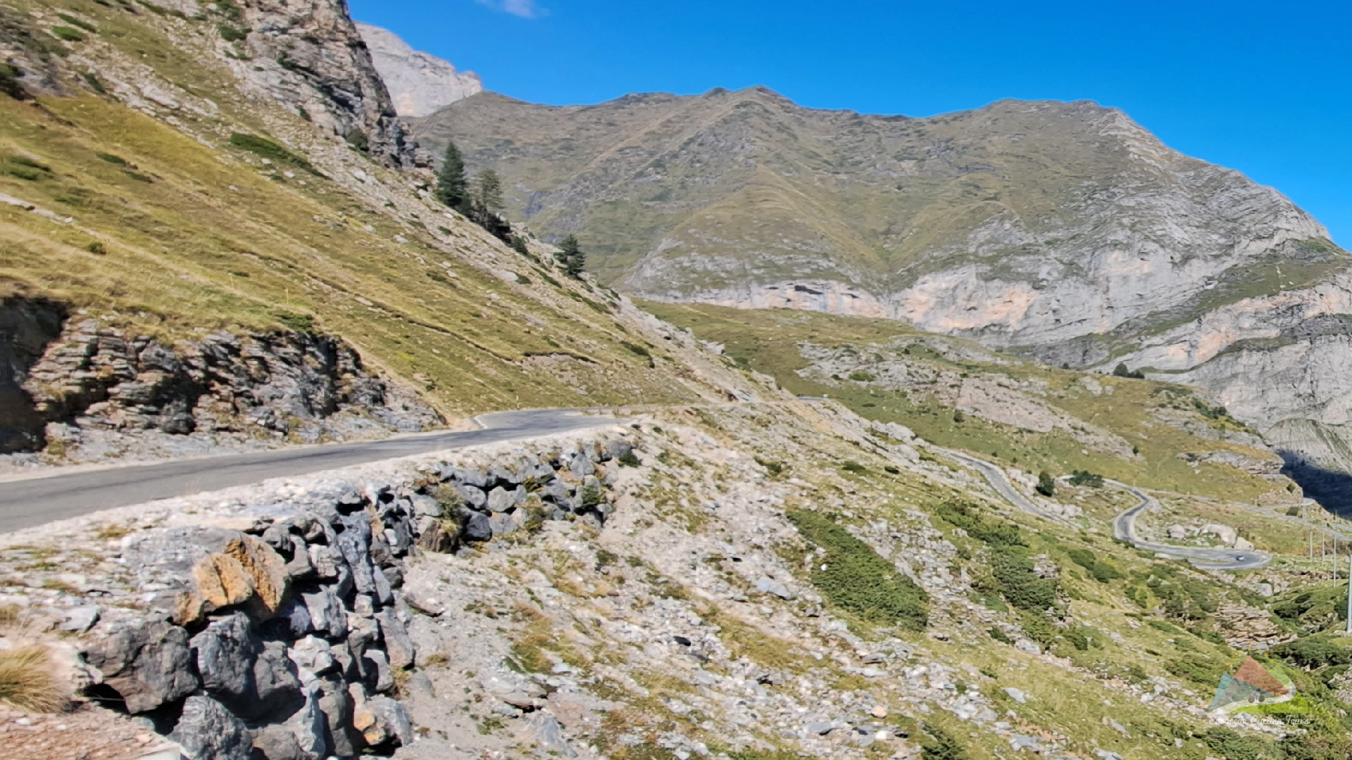 A cyclist enjoying the picturesque ride up the col du galibier mountain pass in the french alps discover our professional range of guided cycling holidays across europe