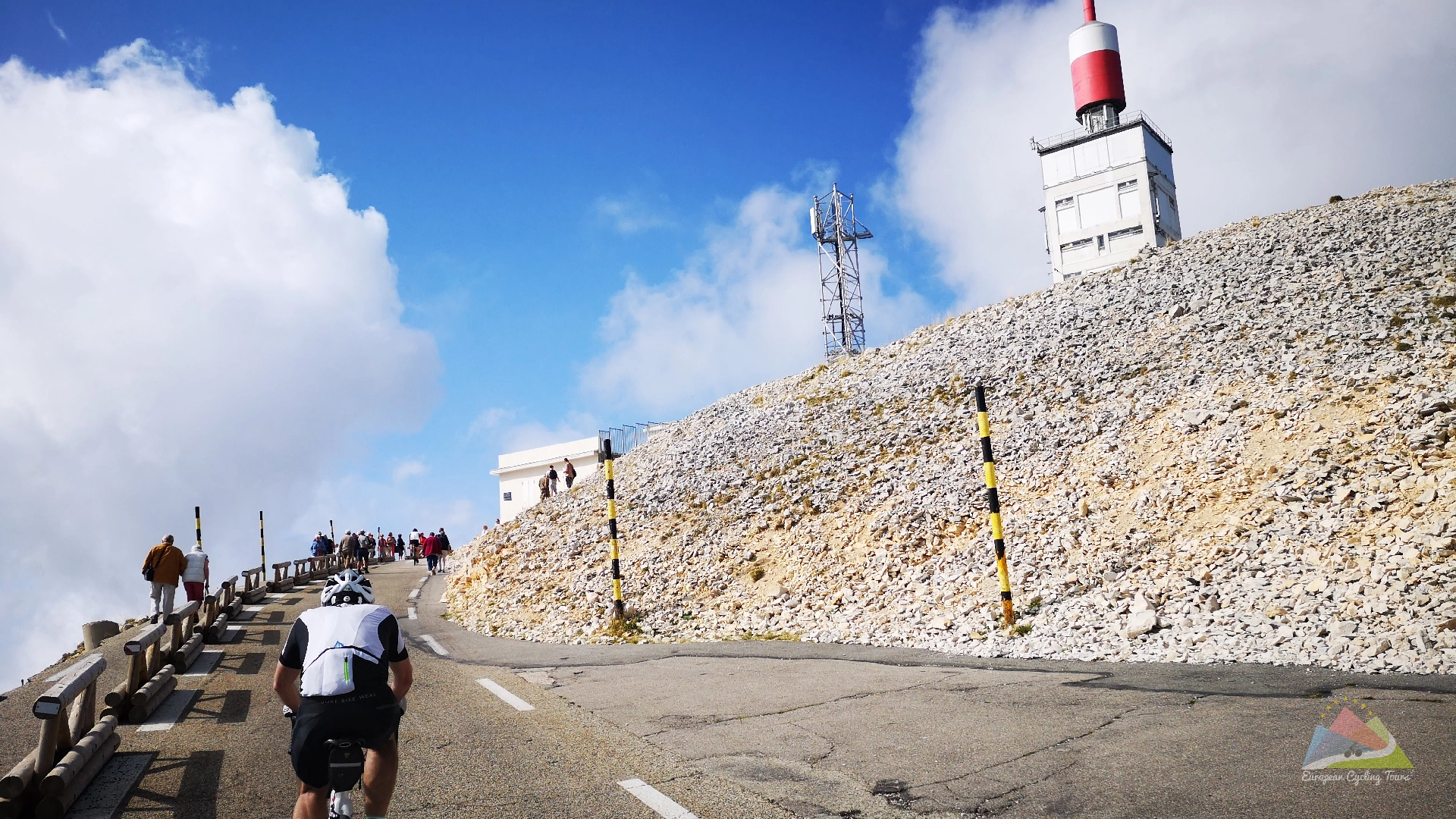 A determined road cyclist pushes toward the final turn of the mont ventoux summit in the provence region browse our collection of professionally supported tours to the most legendary climbs in europe