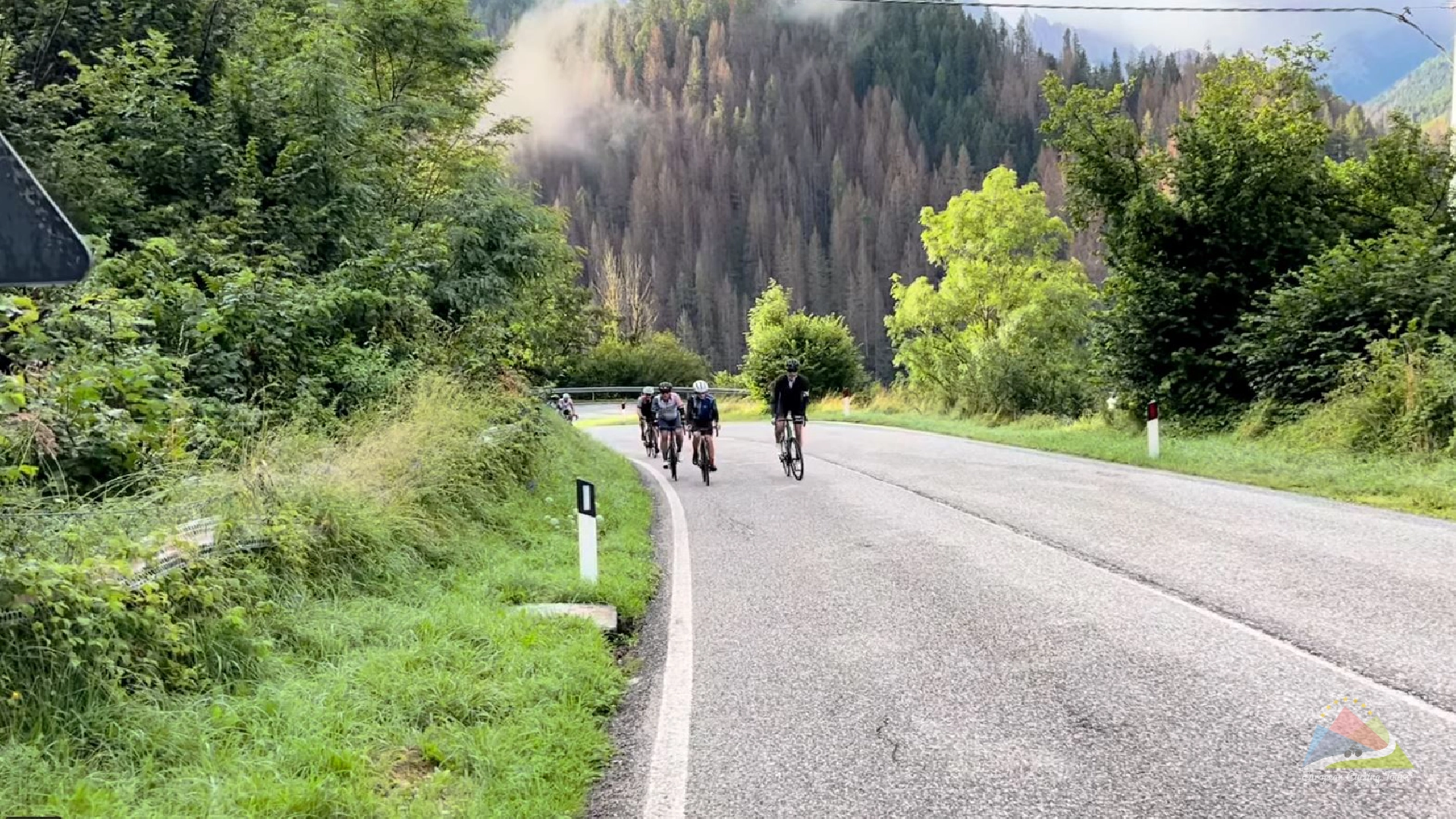 A group of cyclists enjoying a shared ascent on the passo di gavia climb in the italian alps view our comprehensive collection of guided cycling holidays across europe