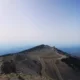 Panoramic cyclists view from the mont ventoux summit overlooking the provence hills during a guided cycling holiday browse our legendary mountain climb itineraries