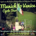 The Italian border at the Brenner Pass in South Tyrol featuring a historic alpine mountain pass for organized road cycling providing triumphant excitement for cyclists celebrating at the flag; explore our Munich to Venice cycling departures.